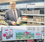 Martin Boschet erklärt das Sortiment im Hofgut-Markt. Darunter Sattelzug im neuen Design.