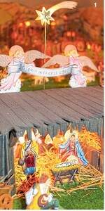 Über dem Dach der Krippe mit dem Kind schweben zwei Engel. Die über 200 beweglichen Figuren sind aus Sperrholz ausgesägt und handbemalt.